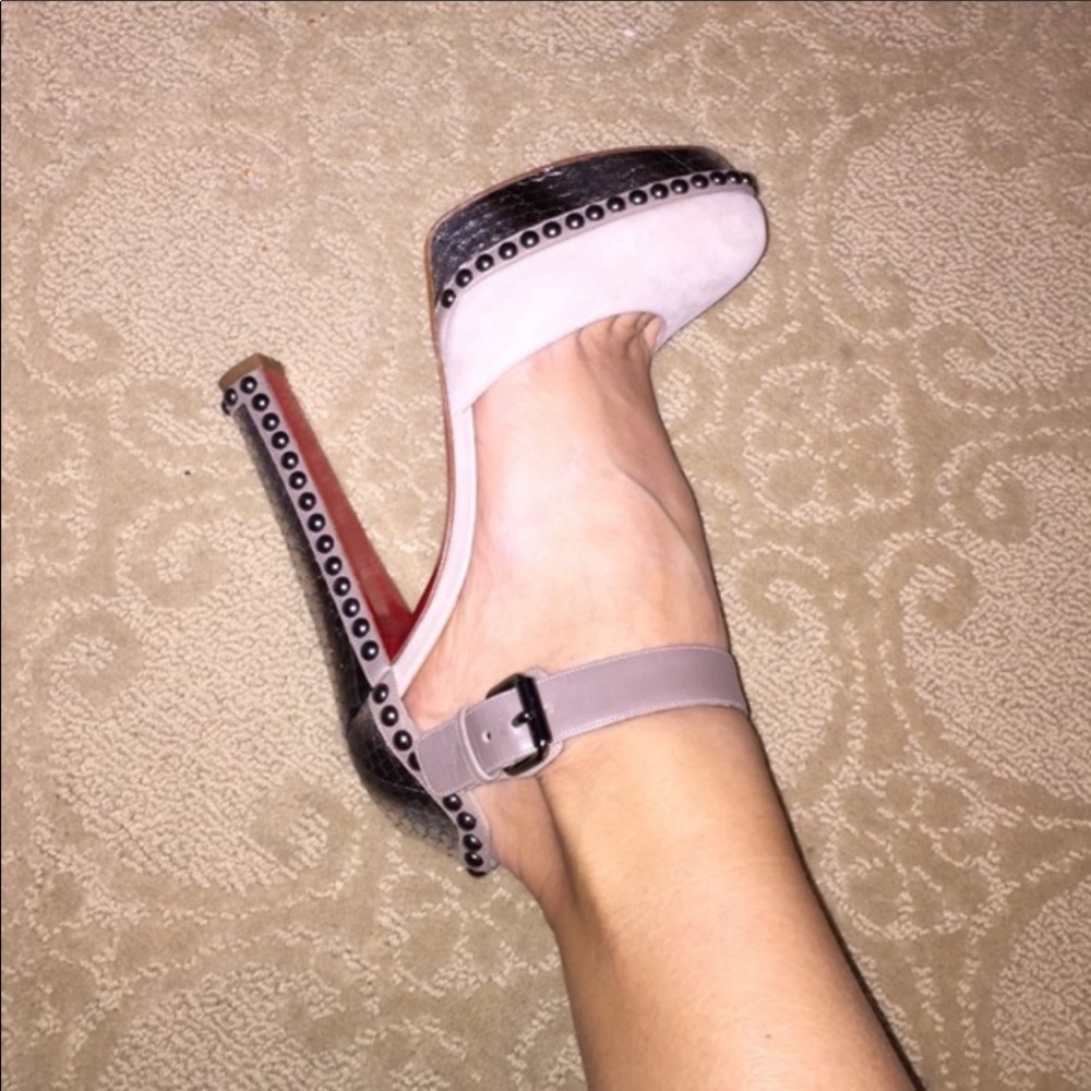 Christian Louboutin Suede/snake skin heel.